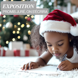 Petite fille écrivant sa lettre au Père Noël